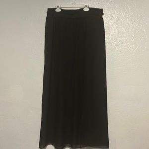 Long sheer skirt over black shorts